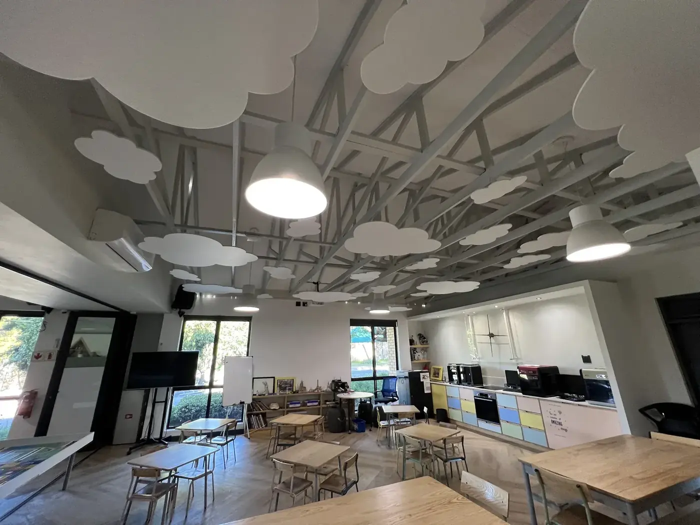 Classroom with felt acoustic clouds on the ceiling at a school in Johannesburg