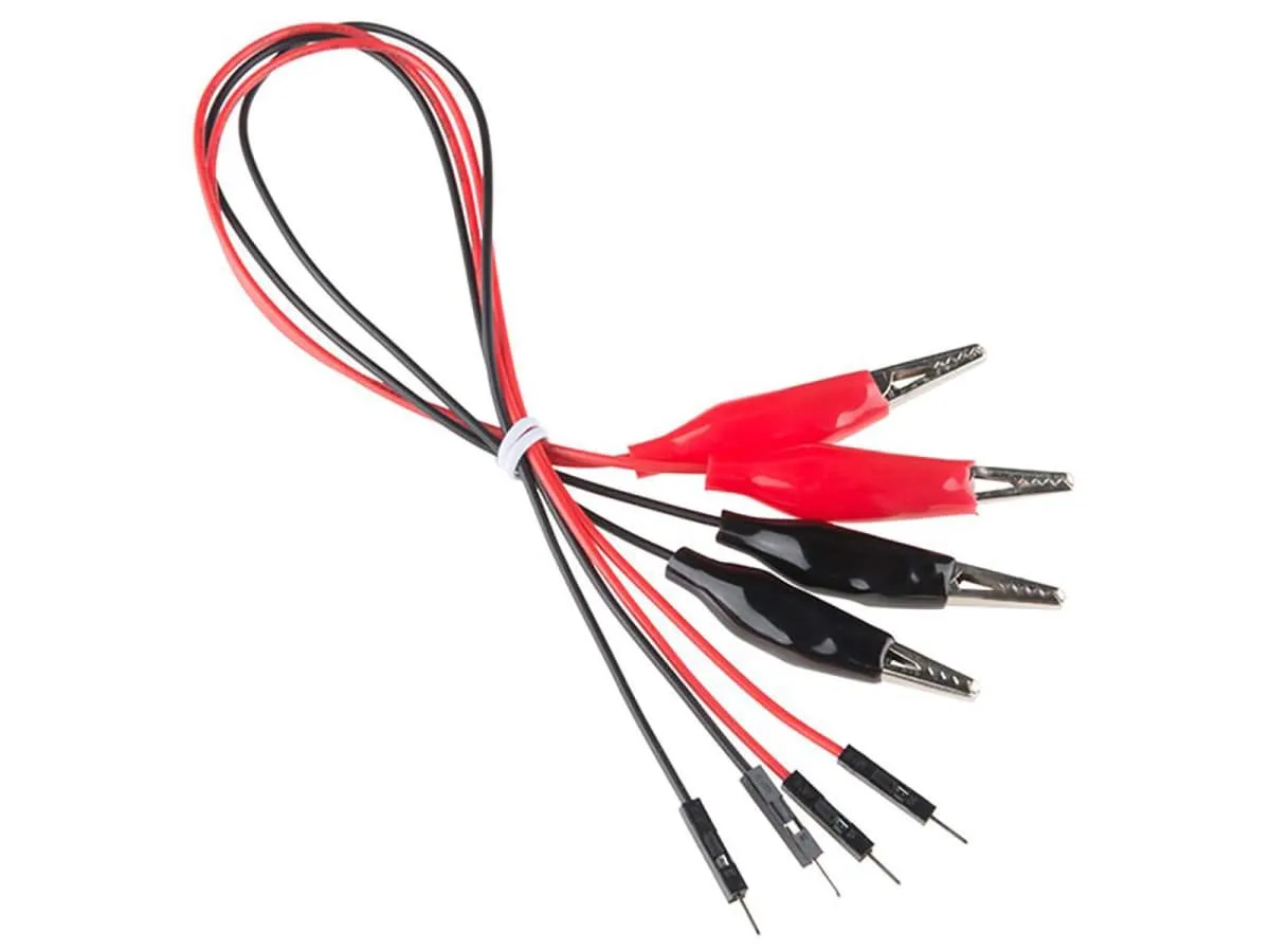 Four Kitronik crocodile clip leads, two red and two black, each with a crocodile clip at one end and a metal pin at the other
