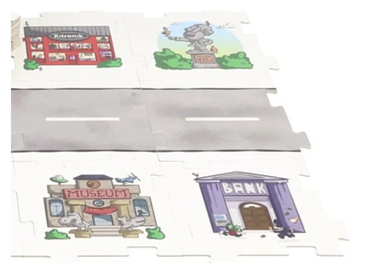 Kitronik Mai-Z floor tiles fitted together as a little town: road tiles and location tiles with a museum, a bank and shops