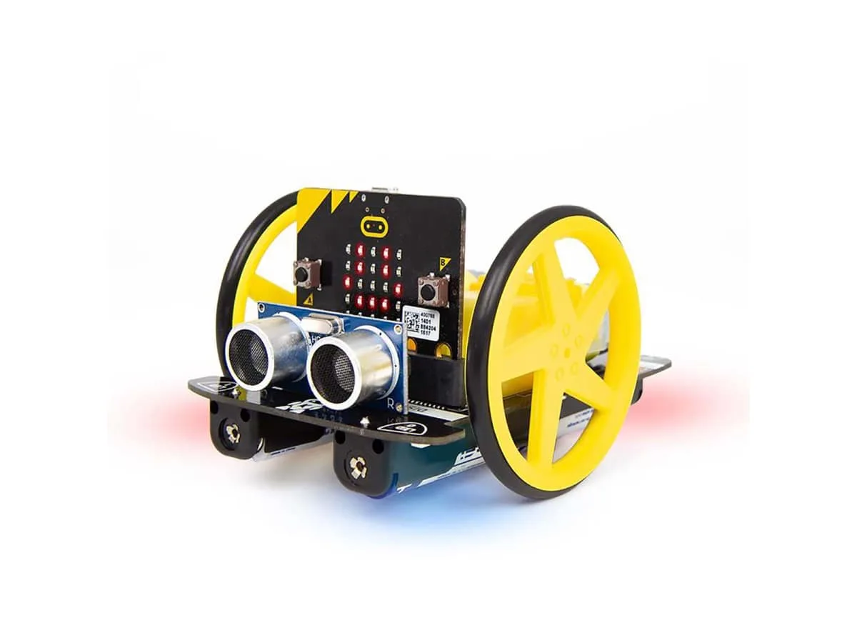 The Kitronik :MOVE Motor robot buggy on white with its yellow wheels and the distance sensor at the front, shown with a micro:bit plugged in (the micro:bit is sold separately)